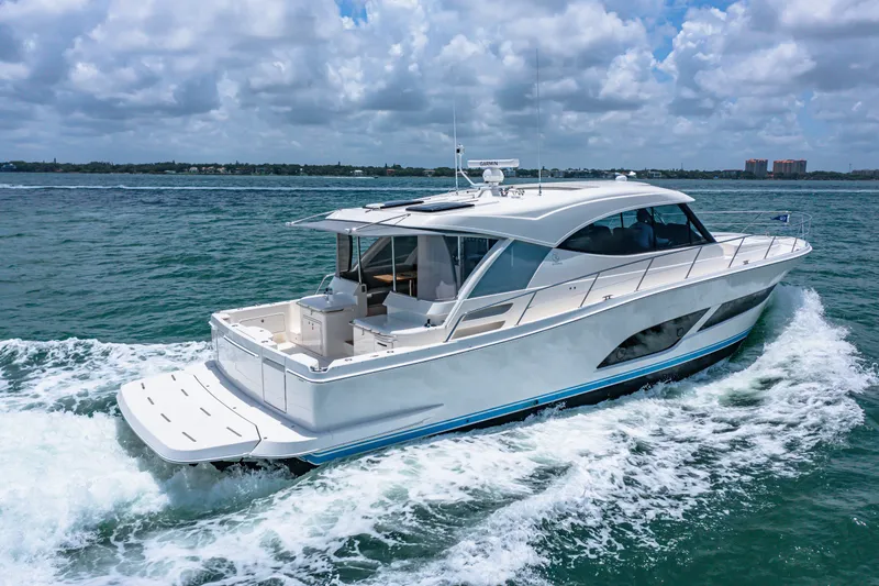 Slide: The Image of 2024 Riviera 505 SUV luxury yacht cruising on open water. - 6