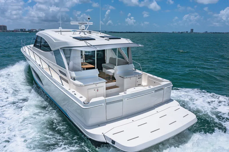 Slide: The Image of 2024 Riviera 505 SUV luxury yacht cruising on open water. - 7