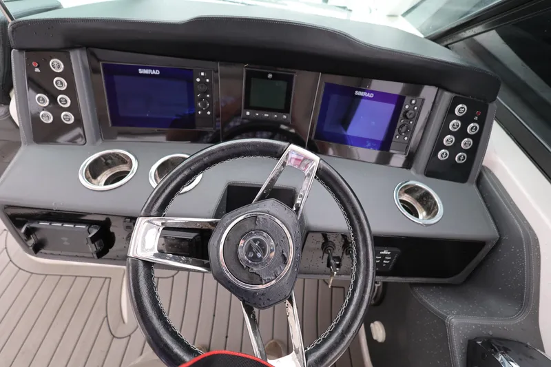 Slide: The Image of 2022 Chaparral 280 OSX helm with dual Simrad displays and modern controls. - 14