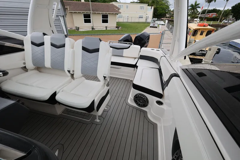 Slide: The Image of 2022 Chaparral 280 OSX boat interior with modern seating and sleek design. - 18