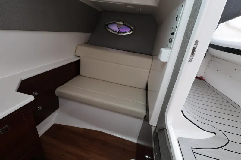 Slide: The Image of 2022 Chaparral 280 OSX cabin interior with seating and modern design. - 21