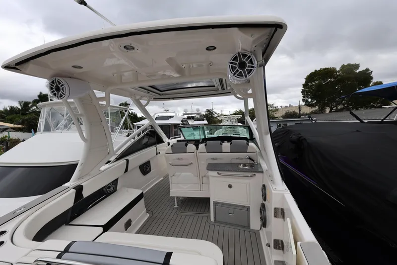 Slide: The Image of 2022 Chaparral 280 OSX boat interior with seating and modern amenities. - 8