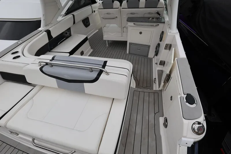 Slide: The Image of 2022 Chaparral 280 OSX boat interior with sleek seating and modern amenities. - 9