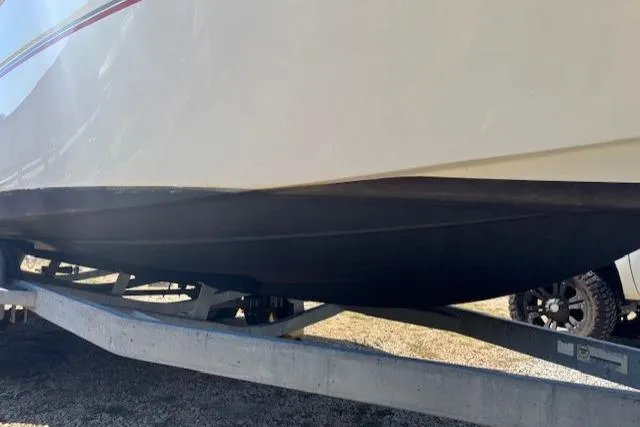 Slide: The Image of 2000 Four Winns 238 Vista boat on trailer, side view. - 17
