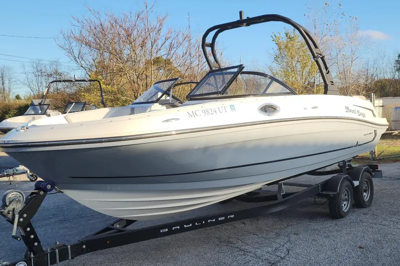 The Image of 2022 Bayliner VR6 Bowrider OB on trailer, parked outdoors, side view. - 1