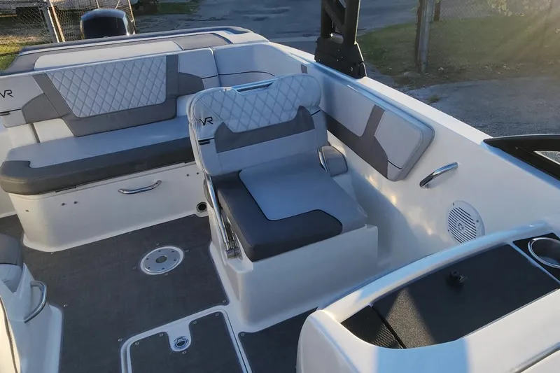 Slide: The Image of 2022 Bayliner VR6 Bowrider OB interior with gray seating and modern design. - 15