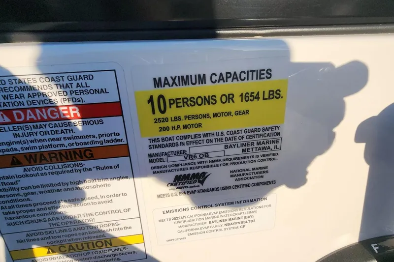 Slide: The Image of 2022 Bayliner VR6 Bowrider OB capacity label, 10 persons or 1654 lbs, 200 HP motor. - 19