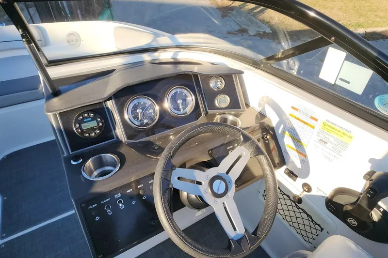 Slide: The Image of 2022 Bayliner VR6 Bowrider OB dashboard with steering wheel and instrument panel. - 20