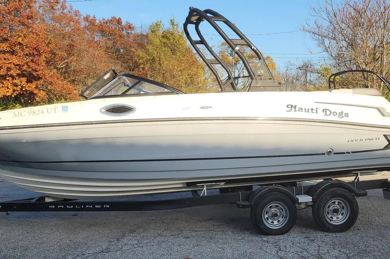 Slide: The Image of 2022 Bayliner VR6 Bowrider OB on trailer, autumn trees in background. - 23