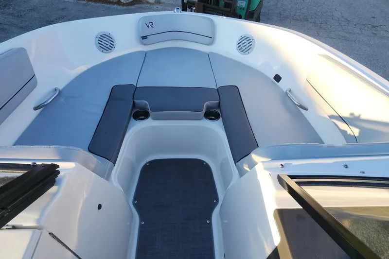 Slide: The Image of 2022 Bayliner VR6 Bowrider OB interior with spacious seating and cup holders. - 5