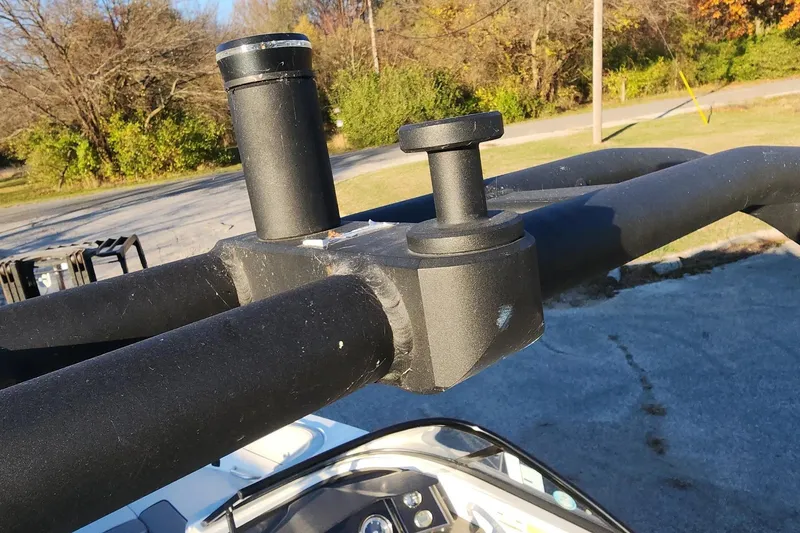 Slide: The Image of 2022 Bayliner VR6 Bowrider OB boat detail with black metal fittings and outdoor background. - 6