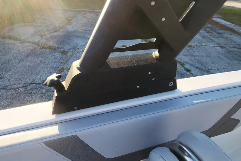 Slide: The Image of 2022 Bayliner VR6 Bowrider OB boat detail with sunlight and seating. - 7