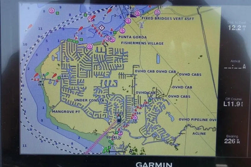 Slide: The Image of Marine navigation chart on Garmin display, showing Punta Gorda area with depth markers and routes. - 13
