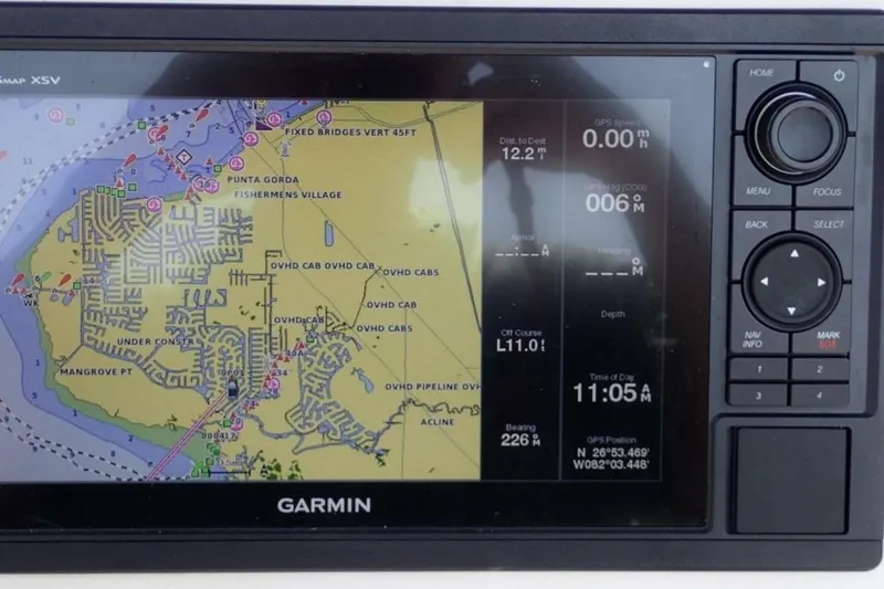 Slide: The Image of Garmin GPS display on 2023 Cobia 217 CC boat, showing navigation map and data. - 14