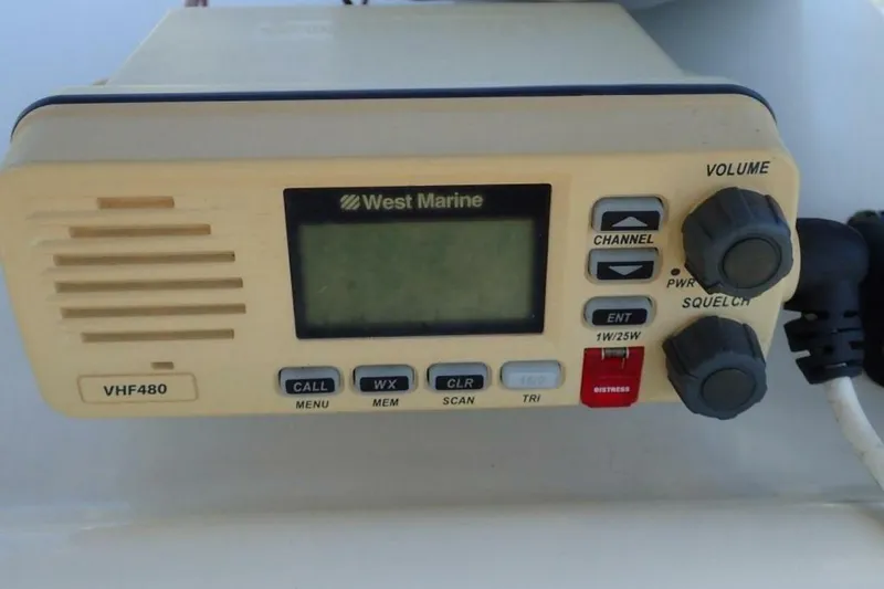 Slide: The Image of West Marine VHF480 radio on 2023 Cobia 217 CC boat dashboard. - 15