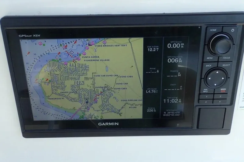 Slide: The Image of Garmin GPS display on 2023 Cobia 217 CC boat, showing navigation map and data. - 9