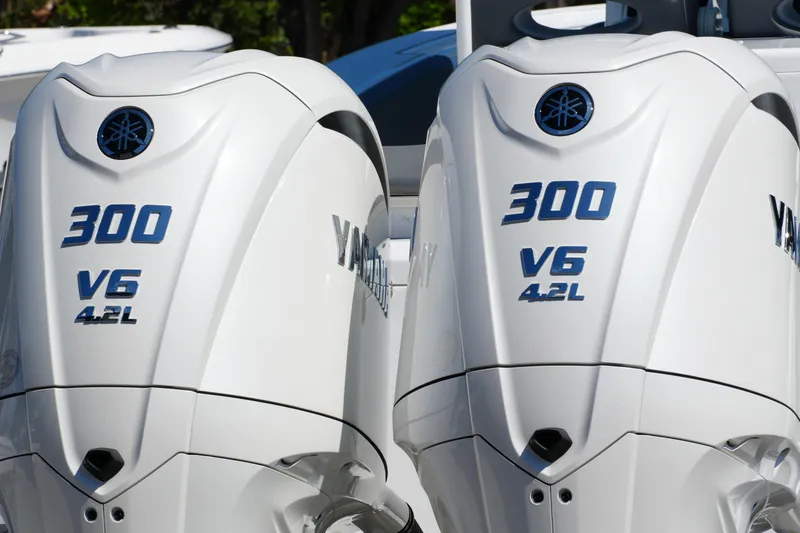 Slide: The Image of Twin Yamaha 300 V6 4.2L outboard engines on a 2025 NauticStar 292 Legacy boat. - 10