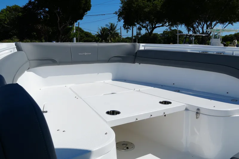 Slide: The Image of 2025 NauticStar 292 Legacy boat interior with spacious seating and cup holders. - 14