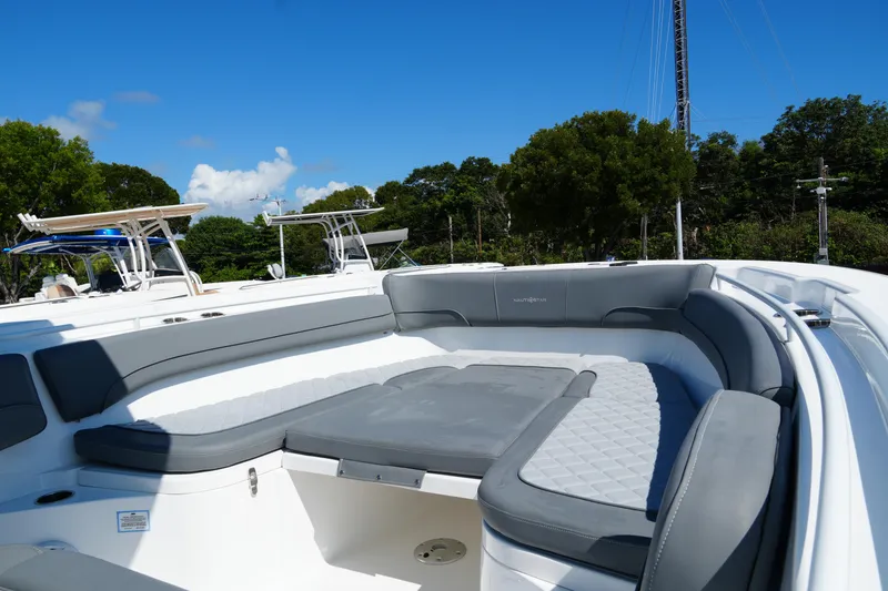 Slide: The Image of 2025 NauticStar 292 Legacy boat with spacious seating and sleek design. - 16