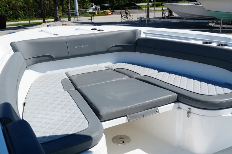 Slide: The Image of 2025 NauticStar 292 Legacy boat with spacious, cushioned seating area. - 18