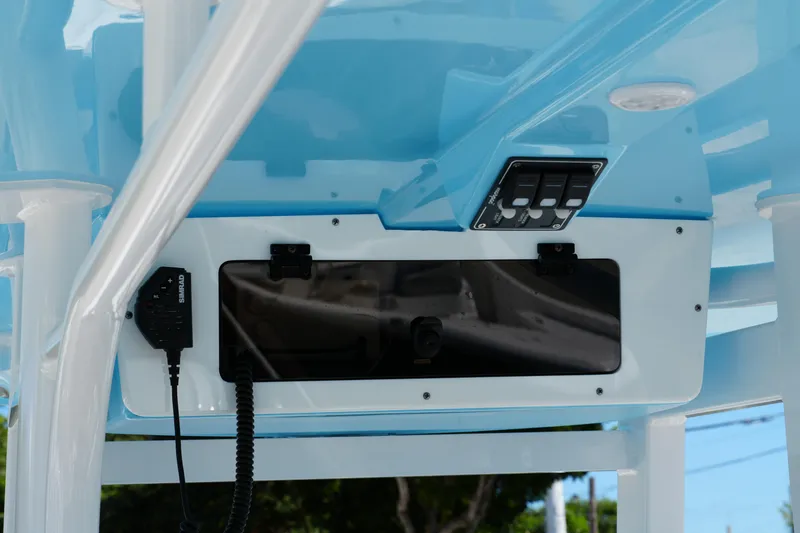 Slide: The Image of 2025 NauticStar 292 Legacy boat console with controls and communication equipment. - 24