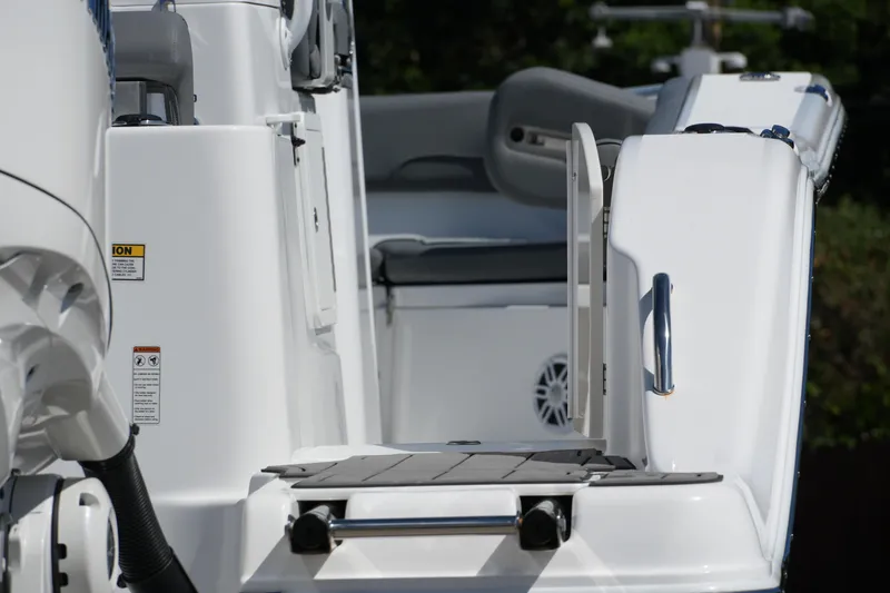 Slide: The Image of 2025 NauticStar 292 Legacy boat deck with seating and safety features. - 26