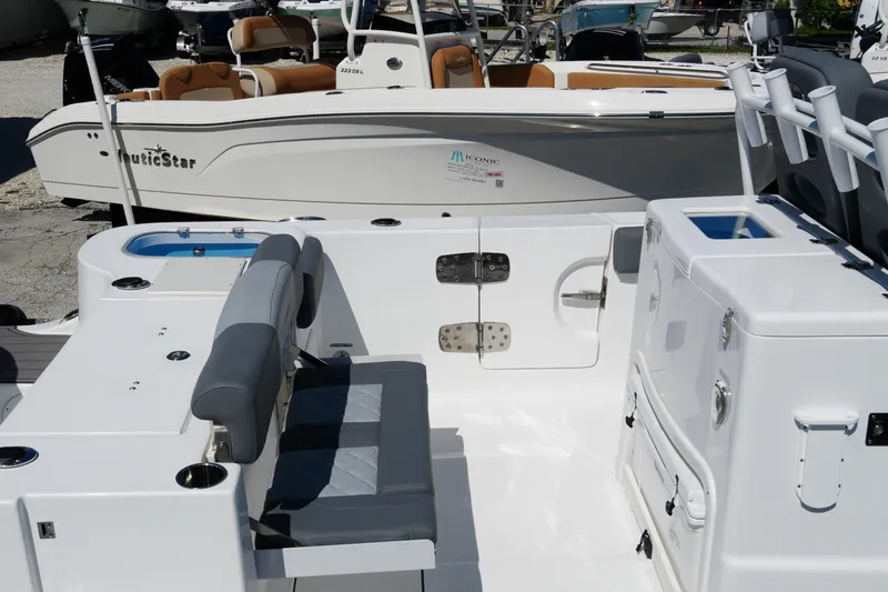 Slide: The Image of 2025 NauticStar 292 Legacy boat interior with seating and storage features. - 27