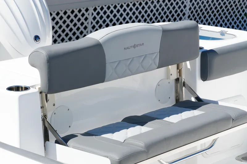 Slide: The Image of 2025 NauticStar 292 Legacy boat seat with gray and white upholstery. - 28