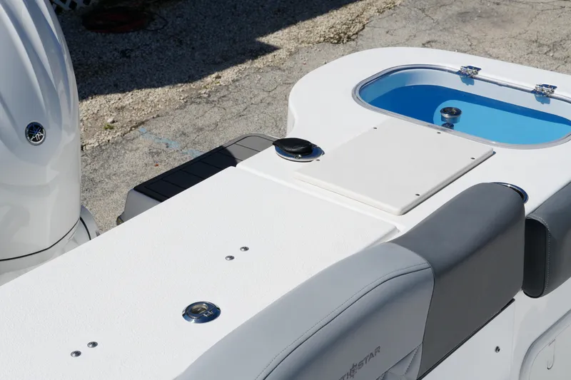 Slide: The Image of 2025 NauticStar 292 Legacy boat interior with seating and livewell. - 29