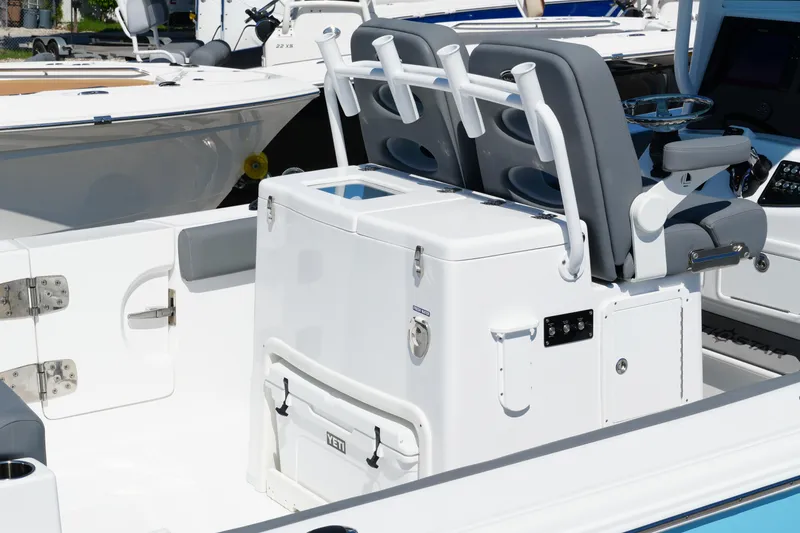 Slide: The Image of 2025 NauticStar 292 Legacy boat interior with seating and control panel. - 32