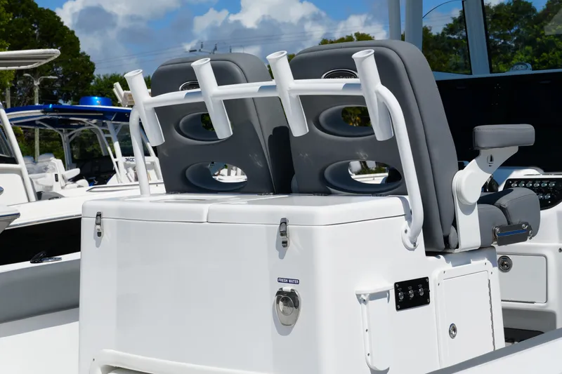 Slide: The Image of 2025 NauticStar 292 Legacy boat seating and rod holders, showcasing modern design. - 33