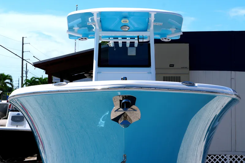 Slide: The Image of 2025 NauticStar 292 Legacy boat with sleek blue hull and modern design. - 6