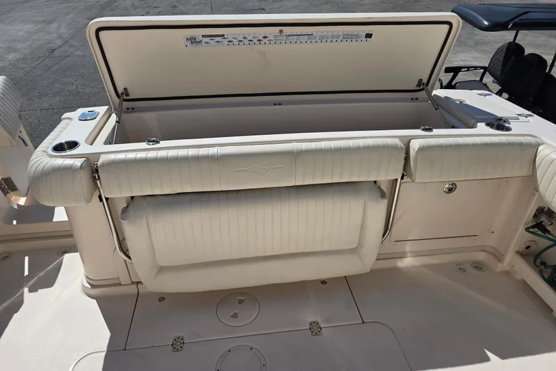 Slide: The Image of 2013 Grady-White Express 330 boat interior with open storage compartment. - 11