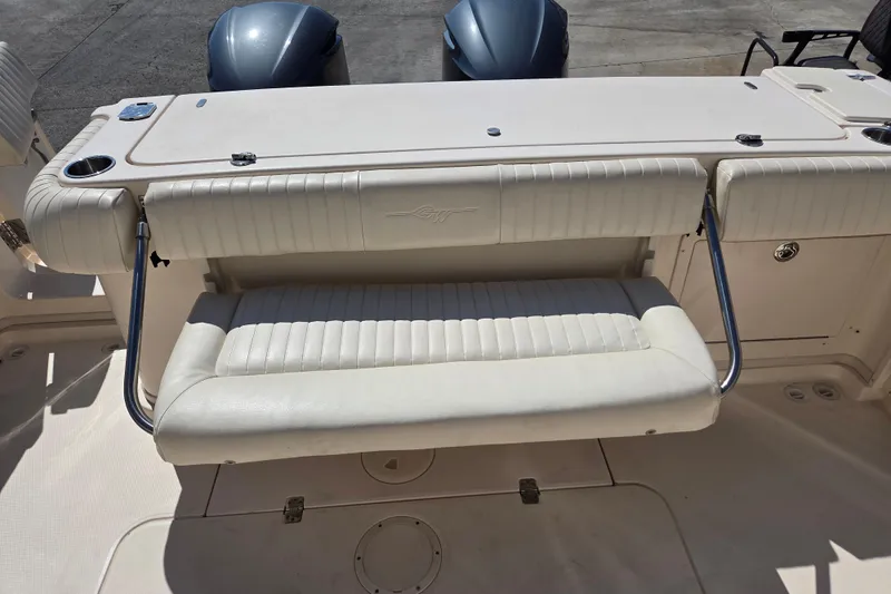Slide: The Image of 2013 Grady-White Express 330 boat with foldable seating and twin engines. - 12