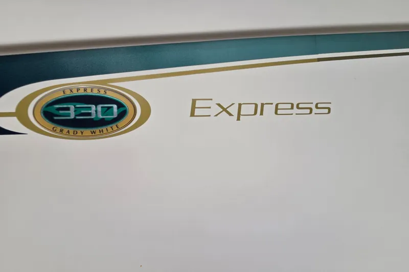 Slide: The Image of Grady-White Express 330 logo on 2013 model boat, featuring elegant design elements. - 7