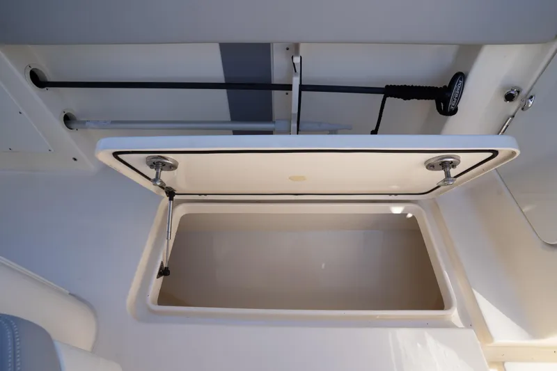 Slide: The Image of Open storage compartment on 2024 Scout 330 LXF boat, showcasing interior space. - 42