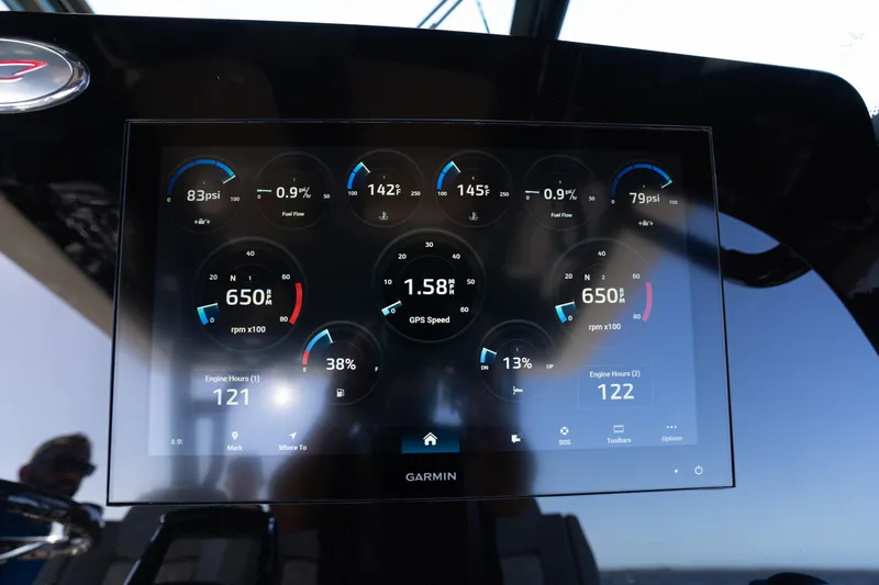 Slide: The Image of Dashboard display of 2024 Scout 330 LXF boat showing engine metrics and GPS speed. - 49