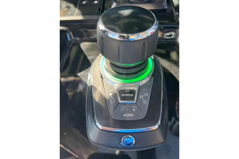 Slide: The Image of 2024 Scout 330 LXF boat control panel with joystick and Skyhook feature. - 71