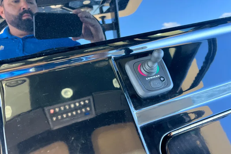 Slide: The Image of 2024 Scout 330 LXF boat control panel with Lewmar joystick. - 86