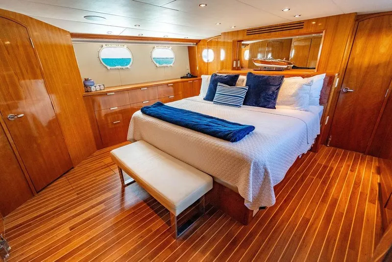 Slide: The Image of Luxurious bedroom interior of 2003 Hatteras 75' Cockpit MY yacht with wood finish. - 11