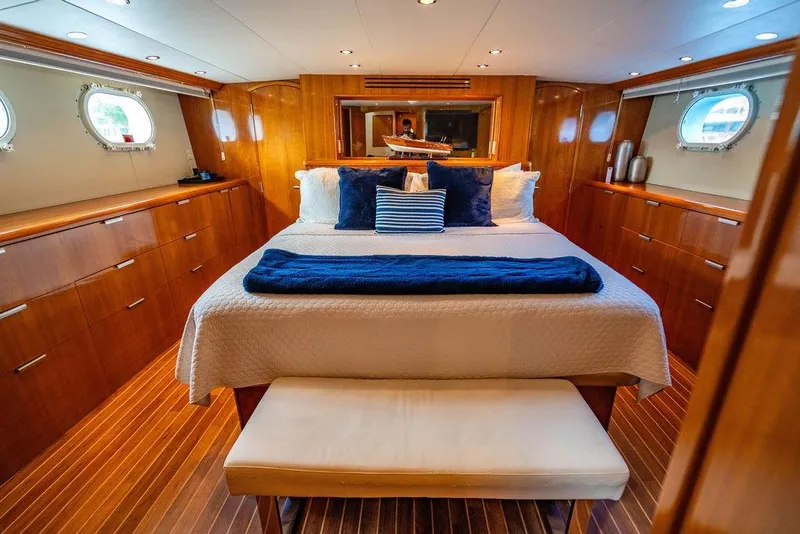 Slide: The Image of Luxurious bedroom interior of 2003 Hatteras 75' Cockpit MY yacht with elegant wood finish. - 12