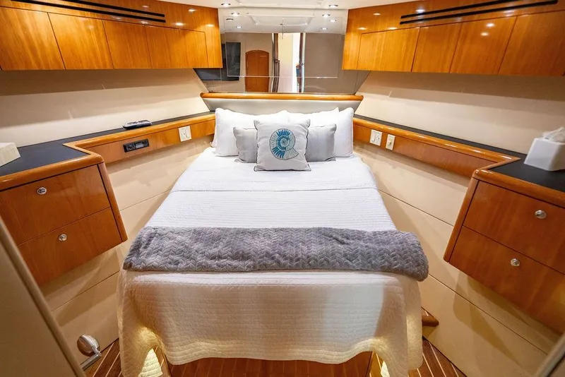 Slide: The Image of Luxurious bedroom interior of 2003 Hatteras 75' Cockpit MY yacht with elegant wood finish. - 15