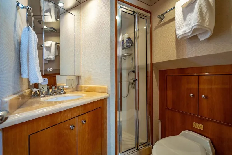 Slide: The Image of Luxurious bathroom in 2003 Hatteras 75' Cockpit MY yacht with shower and vanity. - 17
