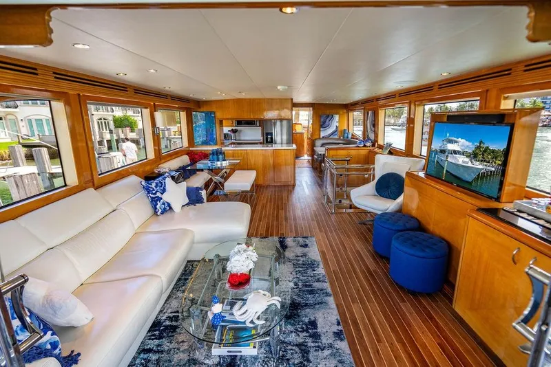 Slide: The Image of Luxurious interior of 2003 Hatteras 75' Cockpit MY yacht with elegant furnishings. - 2