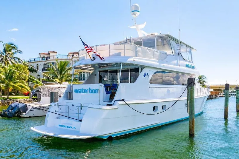 Slide: The Image of 2003 Hatteras 75' Cockpit MY yacht docked in sunny marina setting. - 30