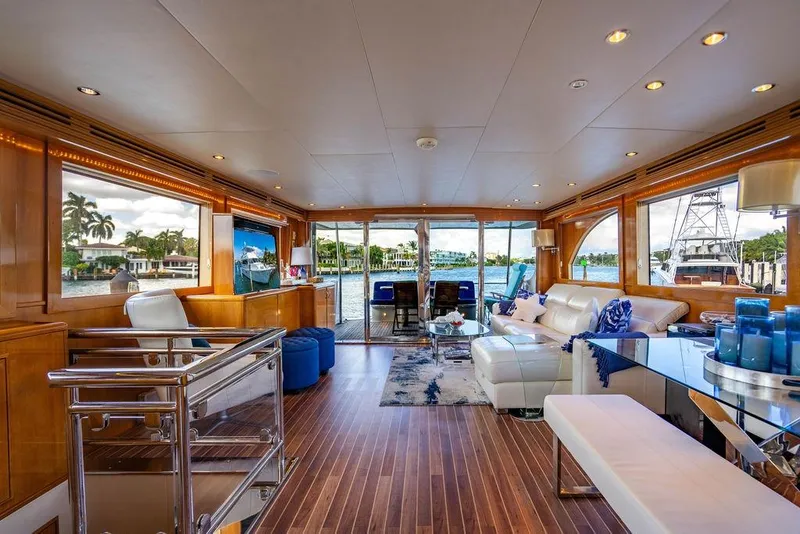 Slide: The Image of Luxurious interior of 2003 Hatteras 75' Cockpit MY yacht with elegant furnishings and waterfront view. - 4