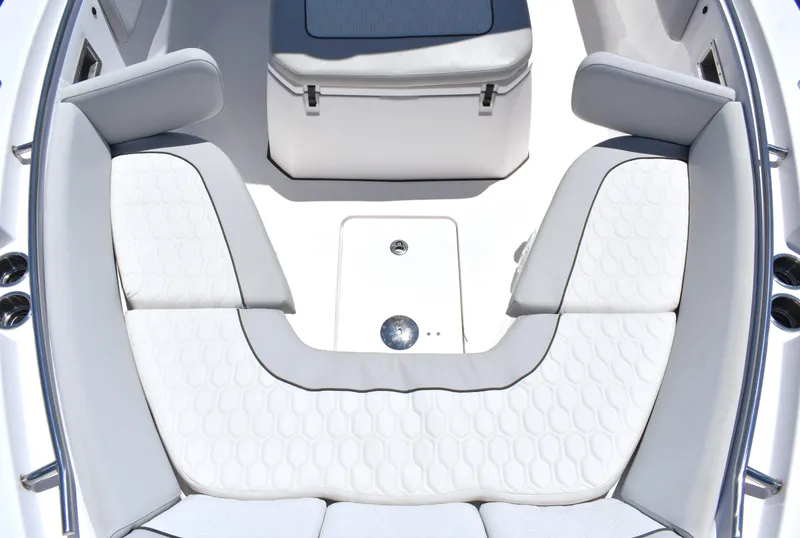 Slide: The Image of 2020 Sea Fox 288 Commander boat interior with white cushioned seating and storage compartment. - 12