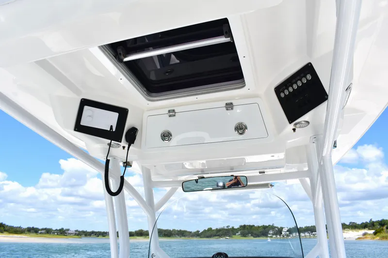 Slide: The Image of 2020 Sea Fox 288 Commander boat interior with control panel and ocean view. - 22