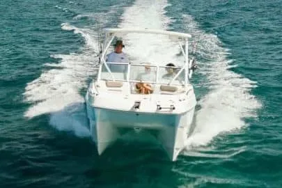 Slide: The Image of Manufacturer Provided Image: 2026 World Cat 230 SD cruising on open water, showcasing sleek design and performance. - 1