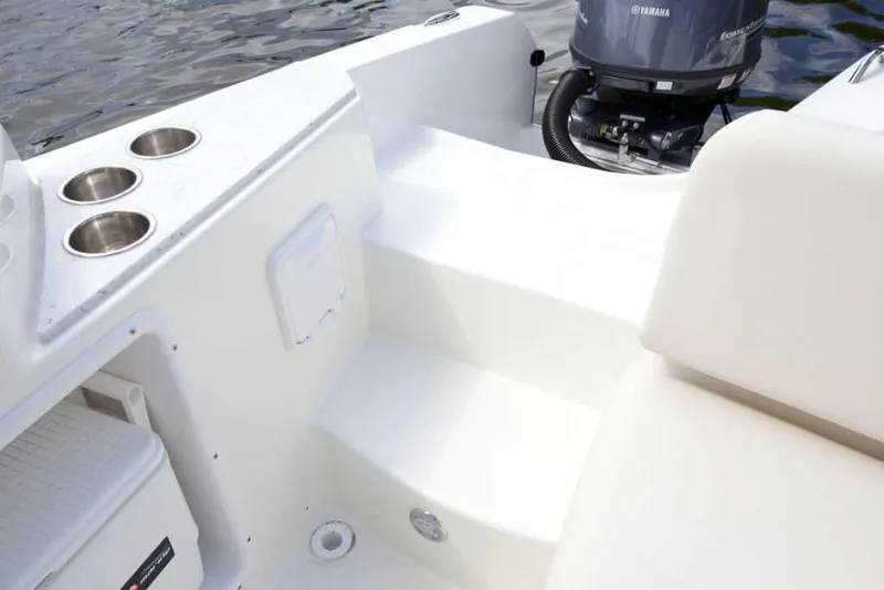 Slide: The Image of Manufacturer Provided Image: 2026 World Cat 230 SD boat interior with cup holders and Yamaha engine. - 18
